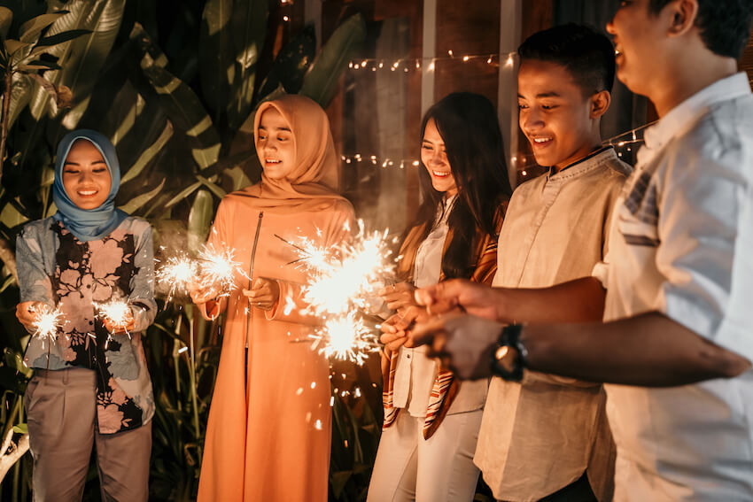 Greetings for Ramadan: friends holding some sparklers