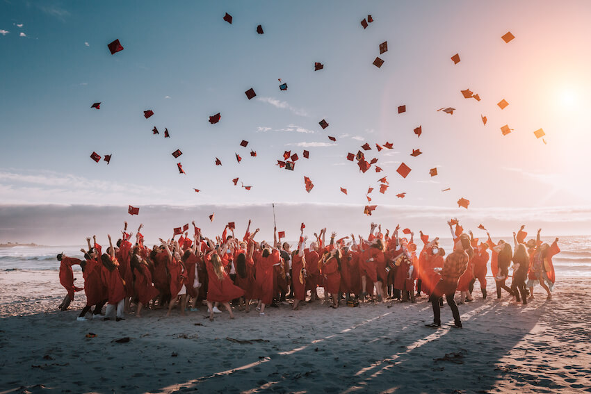 High school graduation party ideas: graduates throwing their caps up in the air