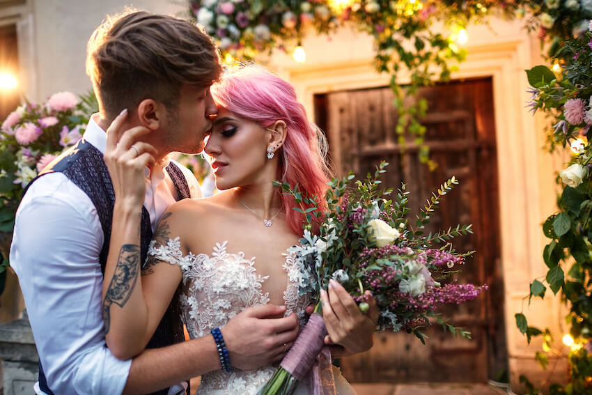 Groom kissing his bride