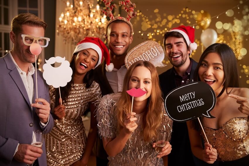 Christmas games for adults: group of friends at a Christmas party