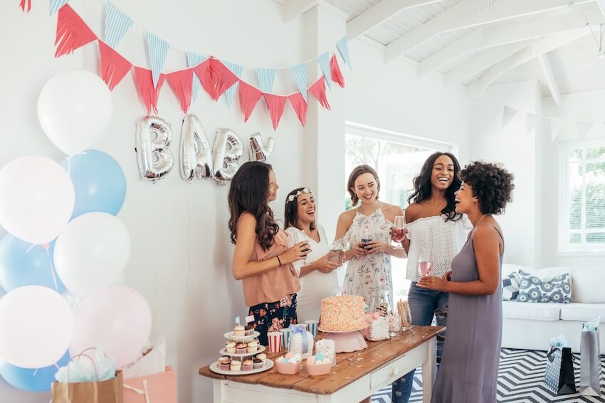 Baby shower etiquette: group of friends celebrating a baby shower