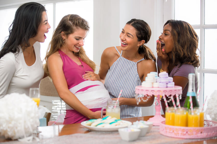 Elephant baby shower: group of friends happily talking to each other