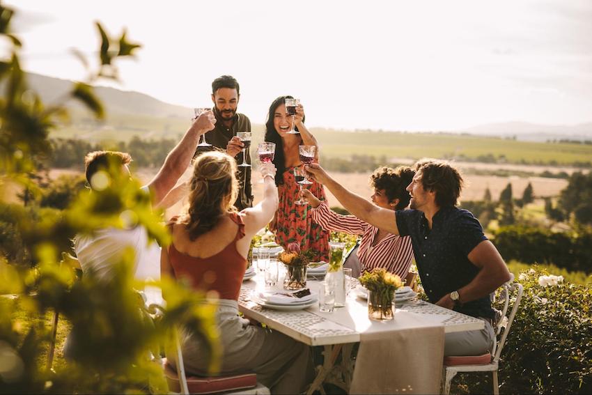 Engagement party etiquette: group of friends having a toast