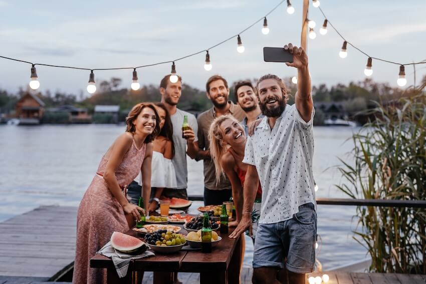 Dinner party invitations: group of friends taking a groufie