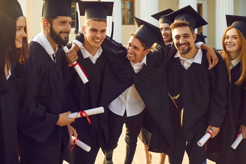 Group of graduates smiling at the camera