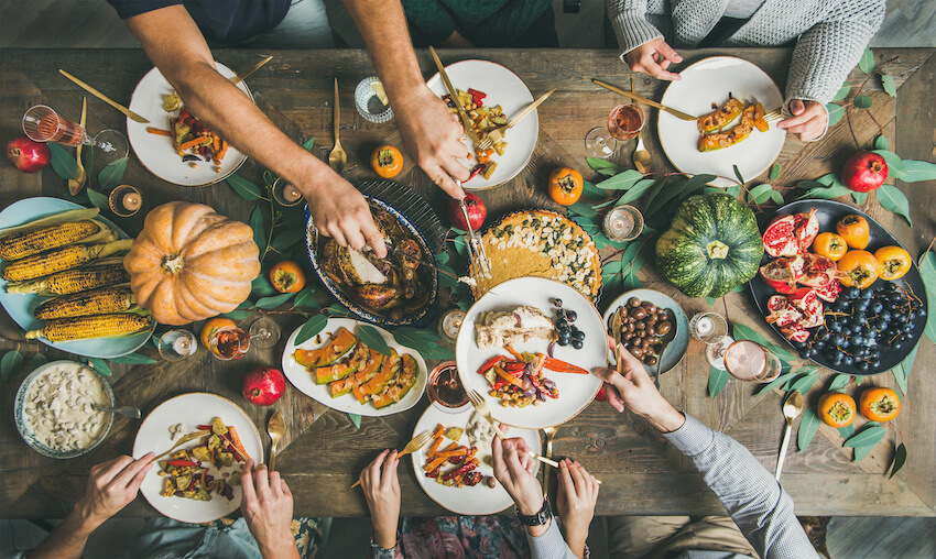 Group of people eating and celebrating Thanksgiving