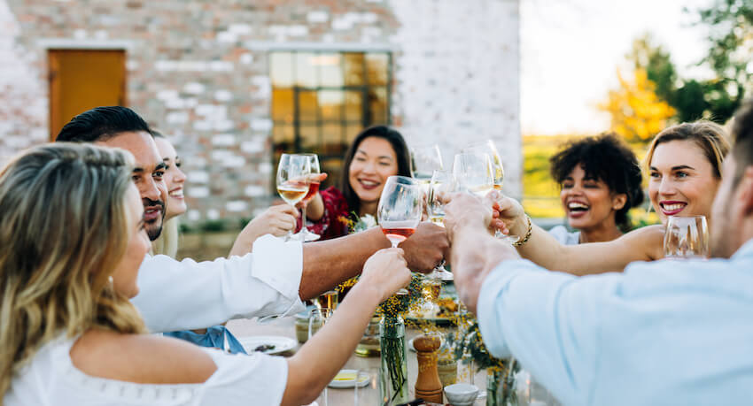Post elopement party: group of people having a toast