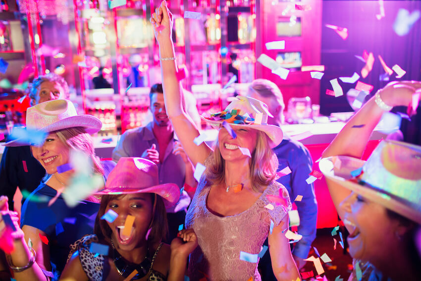 Western theme party: group of people wearing cowboy hats and having a party