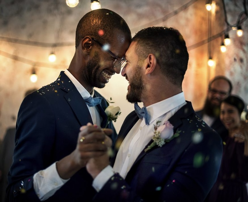 Wedding invitation sets: happy couple dancing at their wedding reception