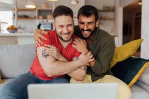 Proposal ideas at home: happy couple at a video call