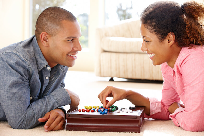 Happy couple playing board games