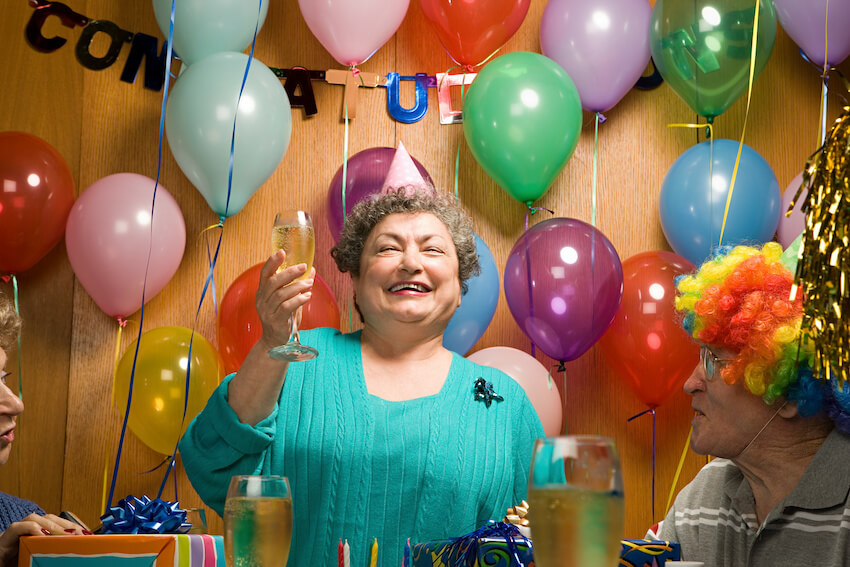 Retirement party ideas: happy senior woman having a party