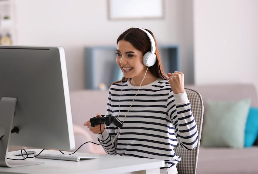 Virtual game night: Woman playing a computer game