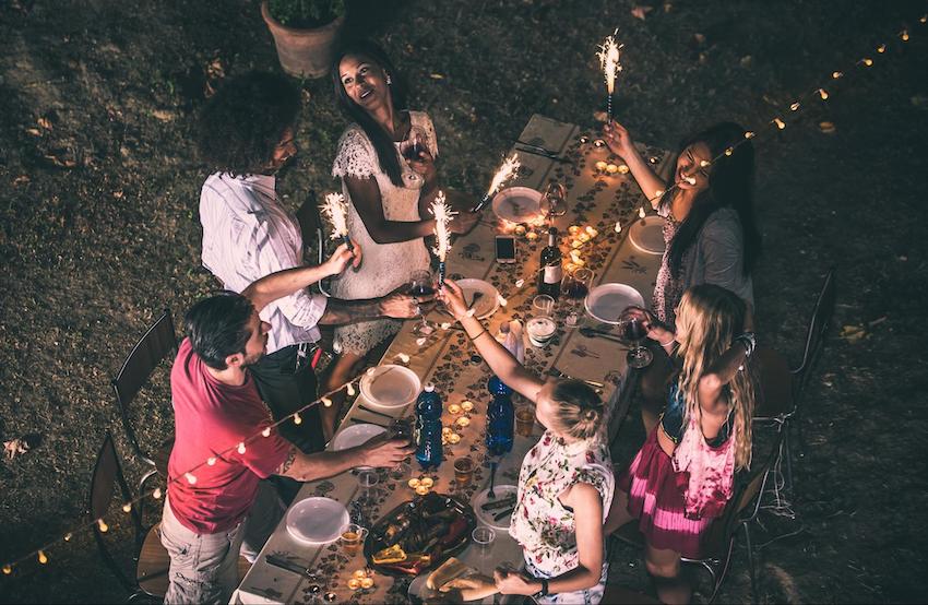 BBQ invitations: group of people eating dinner outside