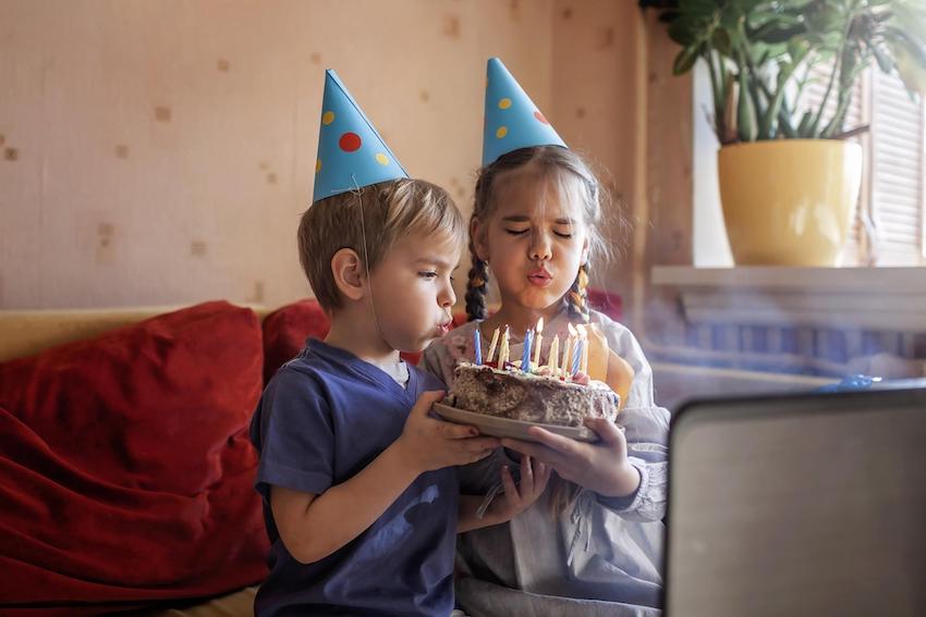 Two kids celebrating birthday online