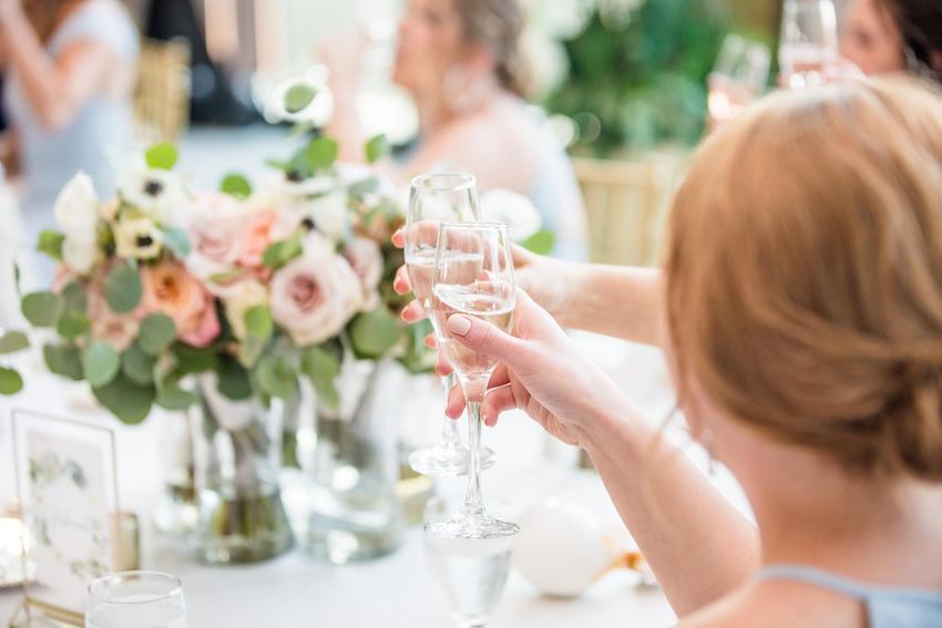 wedding congratulations: woman holding a champagne glass