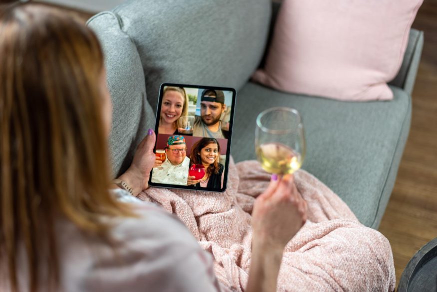 Woman having a virtual happy hour with her friends