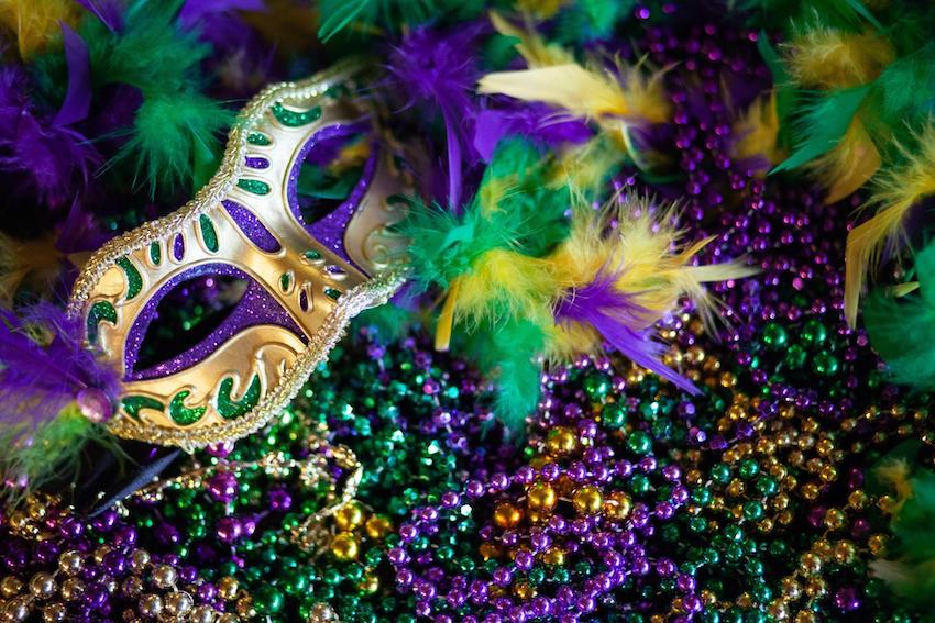 Mardi Gras decorations: Mask, beads and feathers decor background