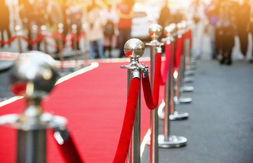 red carpet entrance camera flashes