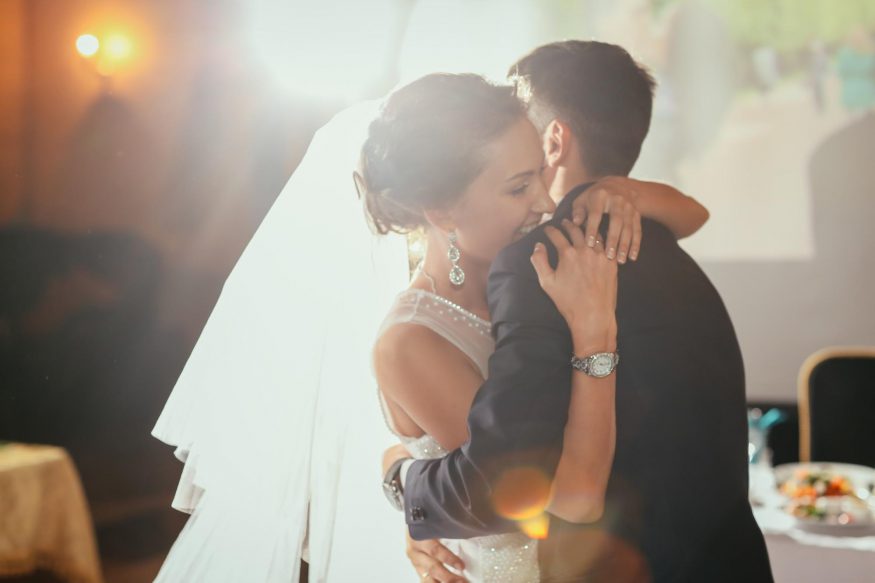 intimate wedding: Bride and groom hugging each other