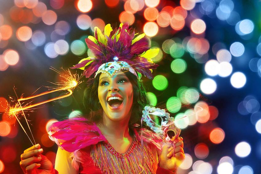 Mardi Gras decorations: Woman in carnival mask and stylish masquerade costume