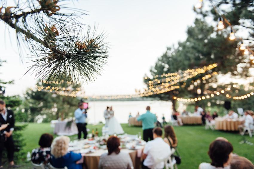 blurred image of a backyard wedding reception