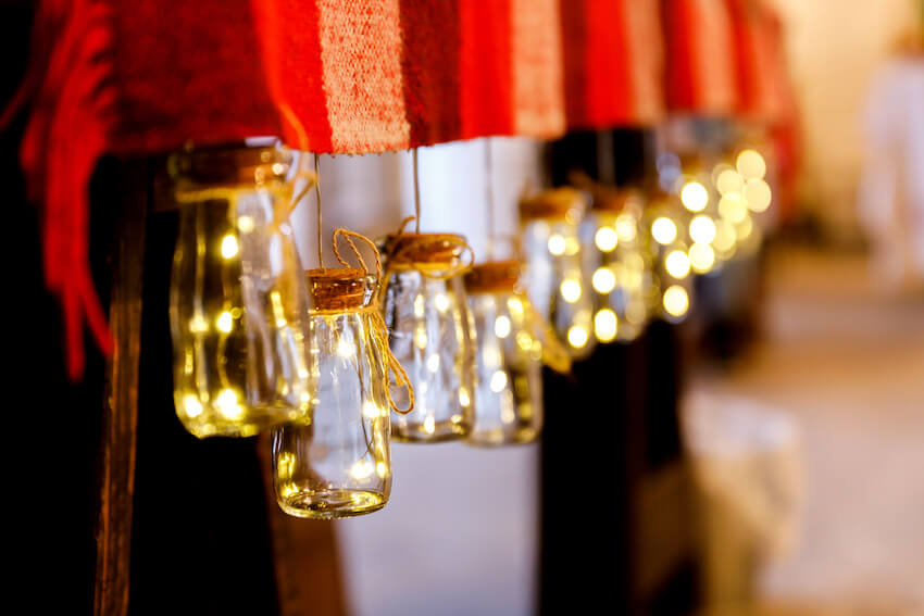 Jars with lights hanging from a cloth