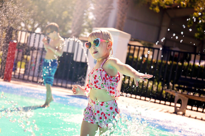 Toddler birthday party ideas: kids playing with water