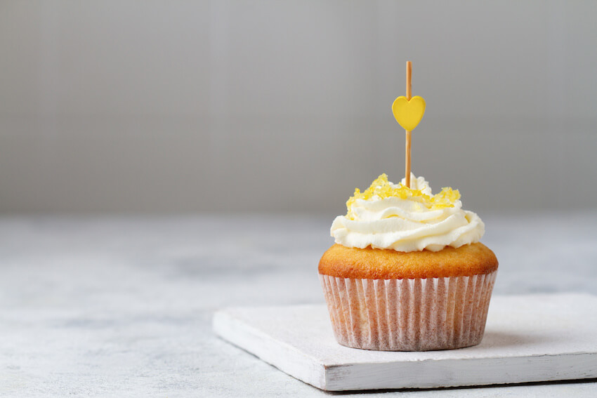 Lemon cupcake with a yellow heart design on top