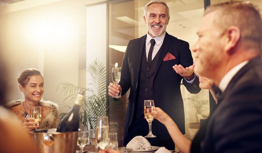 Farewell party invitation: man giving a speech at a party