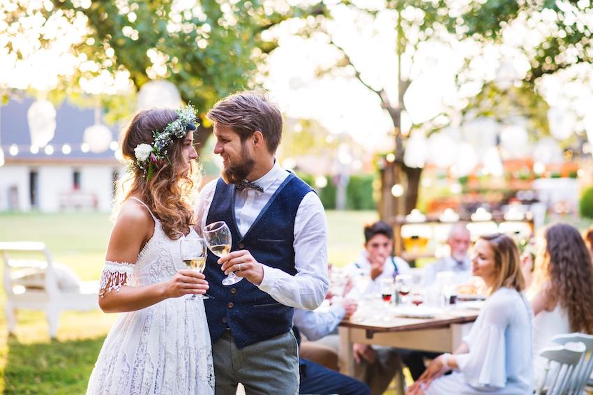 Backyard wedding: married couple having a toast