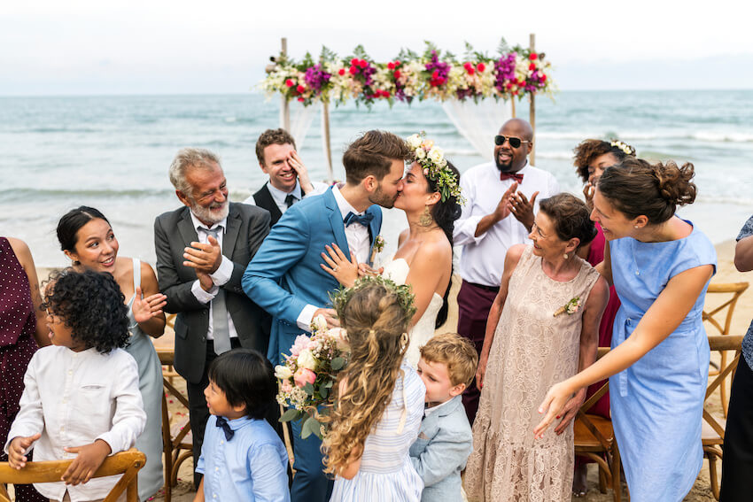 Semi formal wedding: married couple kissing each other