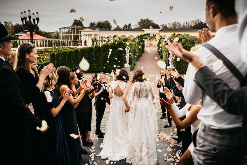 Wedding Couple With A Dog 8 By 15 LGBTQ Lesbian Wedding Bride And   Married Couple Walking Down The Aisle While Guests Throw Petals 