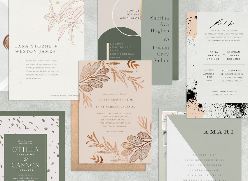 Six modern wedding invitations laid out with their envelopes