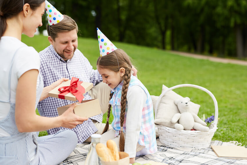 Adoption party ideas: family having a picnic party