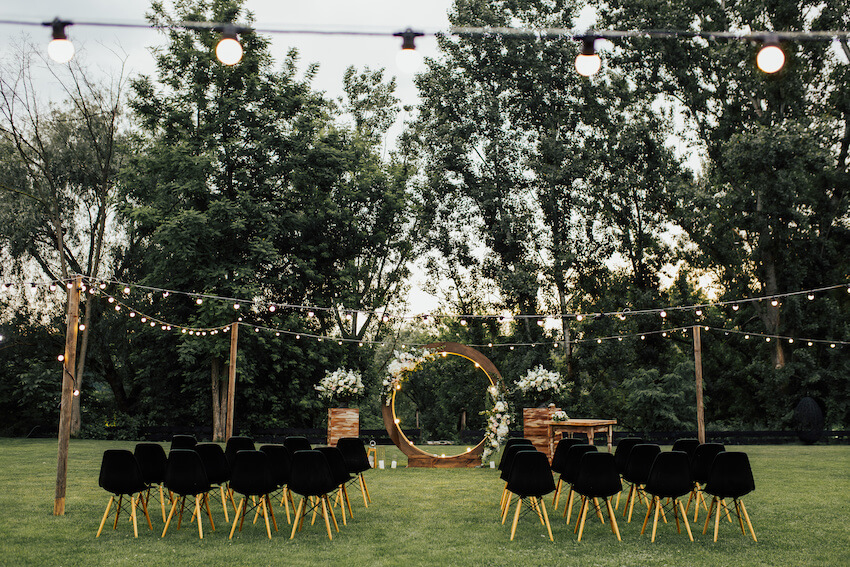All black wedding: outdoor wedding with black chairs