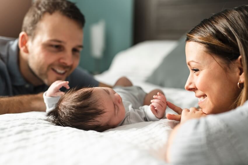 Gifts for new parents: parents adoring their baby