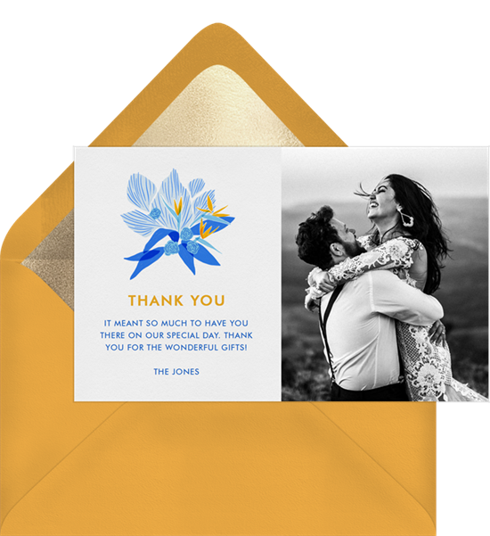 Blue and yellow wedding thank you cards featuring a tropical flower design and photo