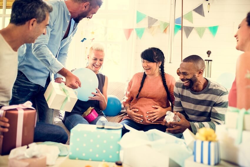 Coed baby shower: people happily celebrating a baby shower