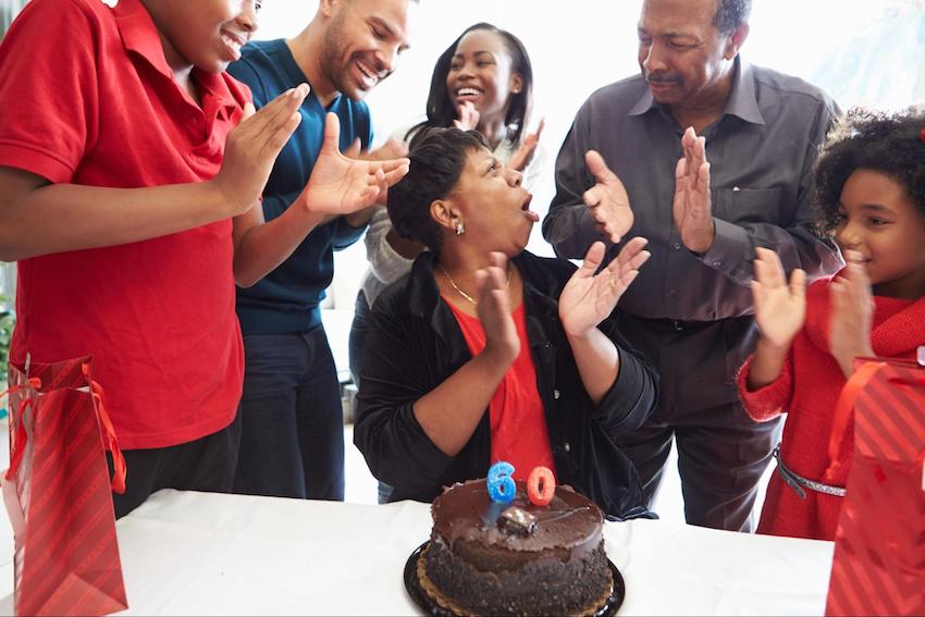 60th birthday invitations: people happily celebrating a birthday