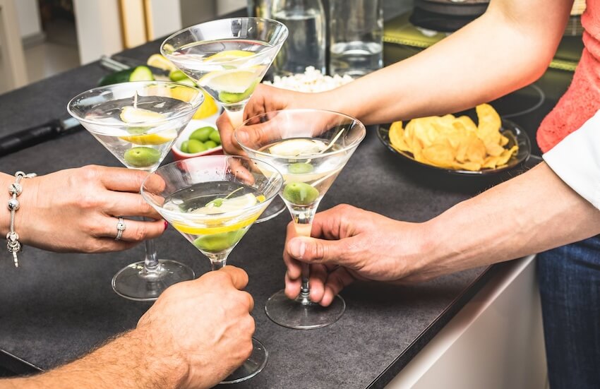 Stock the bar party: people holding martinis