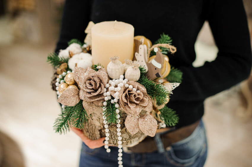 Person holding a Christmas themed bouquet