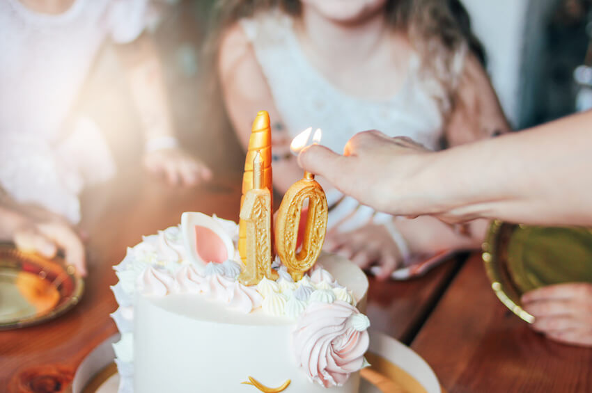 Person lighting up birthday candles