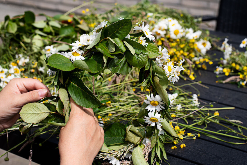 Person making a flower crown