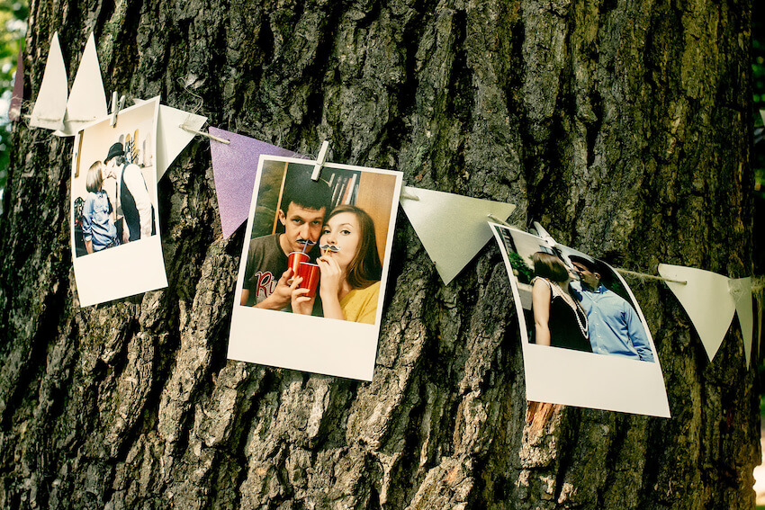 Wedding shower: pictures of a couple placed around a tree