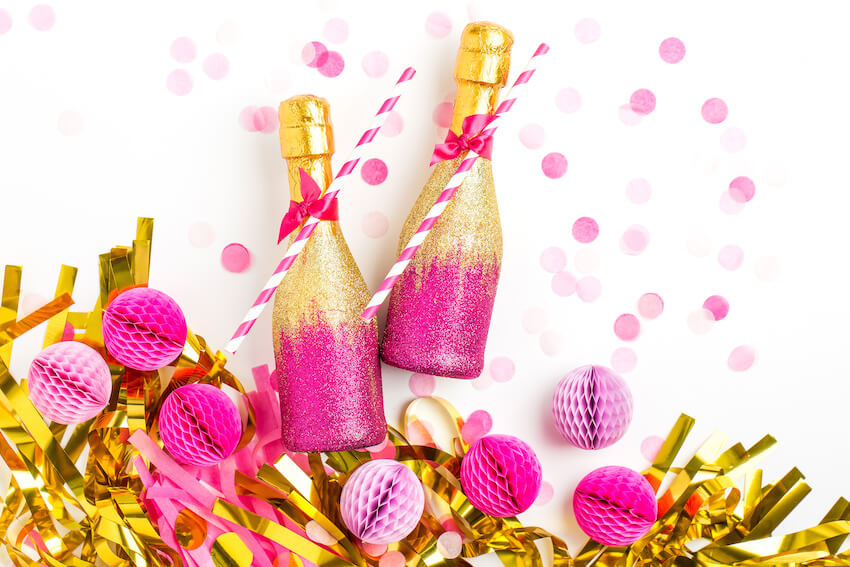 Pink and gold bottles with straws