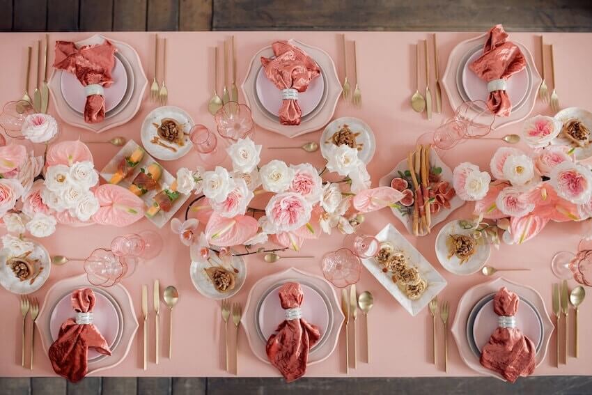 Best wedding colors: pink-themed table setting with flowers