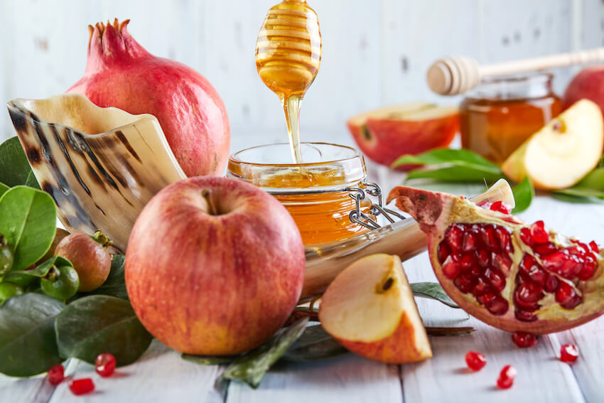 Rosh Hashanah greeting: pomegranates, apples, and honey