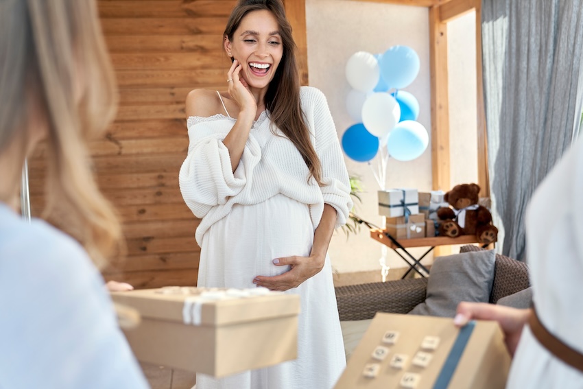 DIY baby shower gifts: pregnant woman receiving gifts
