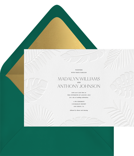Subtle tropical wedding invitation examples with white letterpress palm fronts on white invitations 